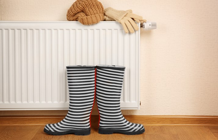 Wellington boots, gloves and hat on radiator