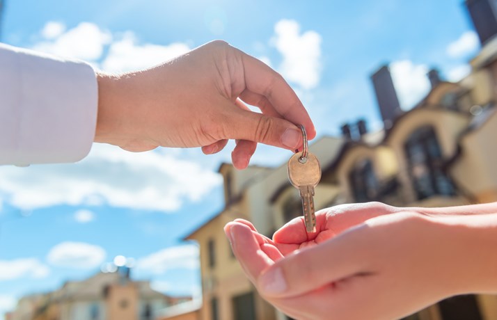 Landlord giving keys to tenant