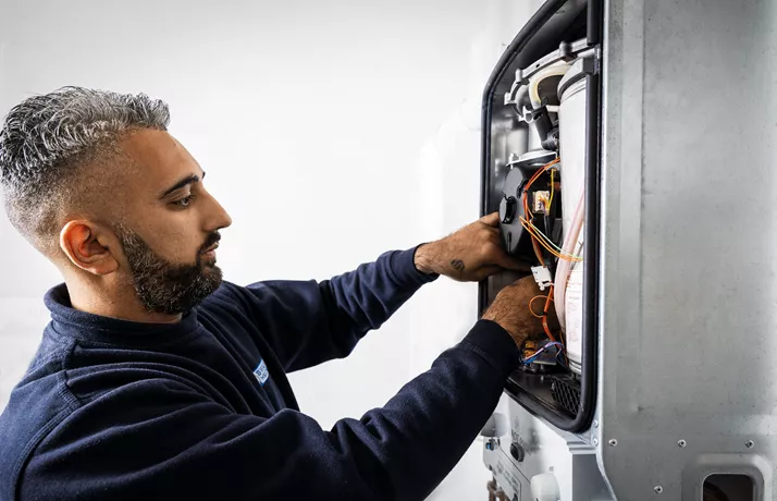 Boiler being repaired by engineer